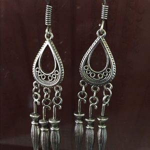 Silver earrings.
